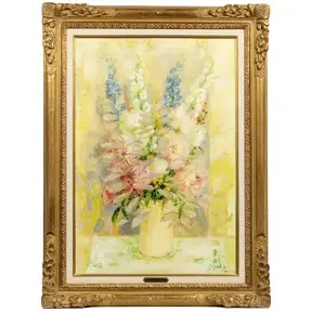 Soft pastel floral still life of a bouquet in a vase with pale yellow and pink blossoms in a gilded frame.